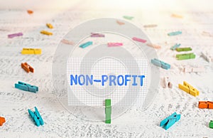 Text sign showing Non Profit. Conceptual photo type of organization that does not earn profits for its owners Green clothespin