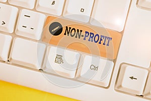 Text sign showing Non Profit. Conceptual photo type of organization that does not earn profits for its owners White pc