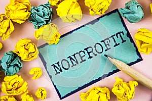 Text sign showing Nonprofit. Conceptual photo Activities that do not generate revenues to the executor written on Sticky Note pape