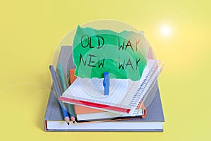 Text sign showing Old Way New Way. Conceptual photo The different way to fulfill the desired purposes Book pencil