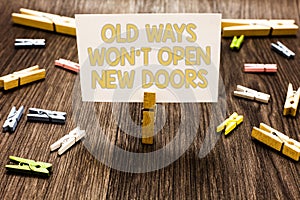 Text sign showing Old Ways Won t not Open New Doors. Conceptual photo be different and unique to Achieve goals Clothespin holding