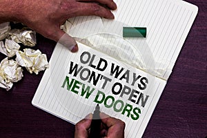 Text sign showing Old Ways Won t not Open New Doors. Conceptual photo be different and unique to Achieve goals Man holding marker