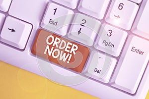 Text sign showing Order Now. Conceptual photo confirmed request by one party to another to buy sell White pc keyboard with empty