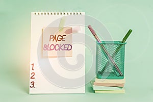 Text sign showing Page Blocked. Conceptual photo Users are prevented from being accessed or used the webpage Spiral notebook