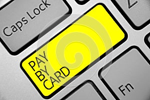 Text sign showing Pay By Card. Conceptual photo Payments on credit Debit Electronic Virtual Money Shopping Keyboard yellow key Int