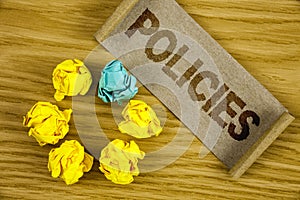 Text sign showing Policies. Conceptual photo Business Company or Government Rules Regulations Standards written on Folded Cardboar