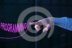 Text sign showing Programming. Conceptual photo the process of preparing an instructional program for a device digital photo