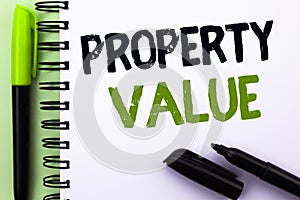 Text sign showing Property Value. Conceptual photo Estimate of Worth Real Estate Residential Valuation written on Notebook Book on