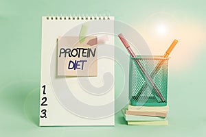 Text sign showing Protein Diet. Conceptual photo low in fat or carbohydrate consumption weight loss plan Spiral notebook sticky
