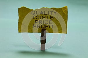 Text sign showing Quality Costs Price Profit. Conceptual photo Balance between wothiness earnings value Paperclip hold torn yellow