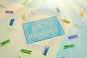 Text sign showing Quality Management. Conceptual photo Maintain Excellence Level High Standard Product Services Colored clothespin