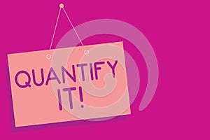 Text sign showing Quantify It. Conceptual photo Measure the size or amount of something and express in numbers Pink board wall mes