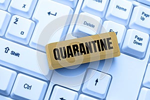 Text sign showing Quarantine. Word Written on restraint upon the activities of person or the transport of goods Typing photo