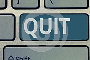 Text sign showing Quit. Conceptual photo Resigning from a job Discontinue the action Stop the activity photo