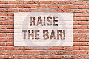 Text sign showing Raise The Bar. Conceptual photo Set higher standards challenges seeking for excellence Brick Wall art photo