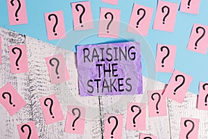 Text sign showing Raising The Stakes. Conceptual photo Increase the Bid or Value Outdo current bet or risk Scribbled and photo