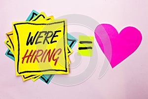 Text sign showing We're Hiring. Conceptual photo Recruiting Hiring Now Recruitment Vacancy Announced Hire written on Yellow Stick