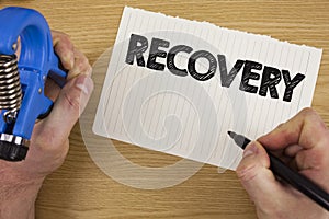 Text sign showing Recovery. Conceptual photo Return to normal state of health Regain possession or control written by Man on Tear