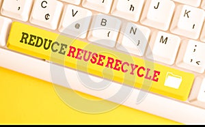 Text sign showing Reduce Reuse Recycle. Conceptual photo environmentallyresponsible consumer behavior White pc keyboard