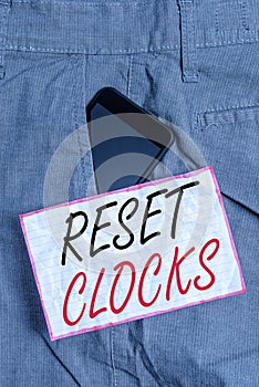 Text sign showing Reset Clocks. Conceptual photo To revisit return to or recreate a time or era from the past Smartphone device