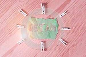 Text sign showing Retain. Conceptual photo Keep in one pay or service specifically or to keep in possession Colored clothespin