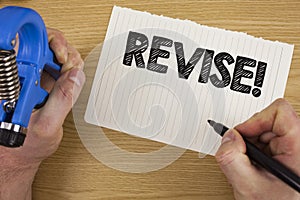 Text sign showing Revise Motivational Call. Conceptual photo Reconsider something to improve it Review written by Man on Tear Note
