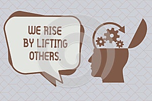 Text sign showing We Rise By Lifting Others.. Conceptual photo Team Spirit we feel Abundant with possibility