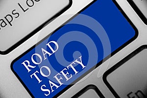 Text sign showing Road To Safety. Conceptual photo Secure travel protect yourself and others Warning Caution Keyboard blue key Int