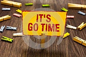 Text sign showing It s is Go Time. Conceptual photo A period to undertake the assigned tasks Bring it ON Clothespin holding yellow