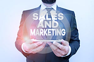 Text sign showing Sales And Marketing. Conceptual photo Promotion Selling Distribution of Goods or Services Male human