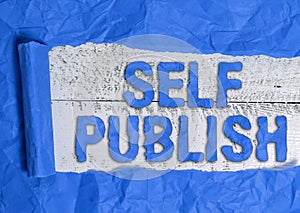 Text sign showing Self Publish. Conceptual photo Published work independently and at own expense Indie Author Rolled