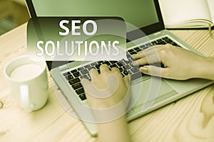 Text sign showing Seo Solutions. Conceptual photo Search Engine Result Page Increase Visitors by Rankings woman laptop