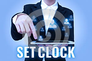 Text sign showing Set Clock. Word Written on put it to the right time or change the clock time to a later time Lady