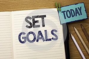 Text sign showing Set Goals. Conceptual photo Target Planning Vision Dreams Goal Idea Aim Target Motivation written on Notebook Bo