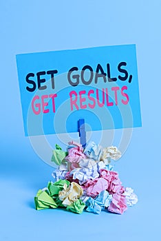 Text sign showing Set Goals Get Results. Conceptual photo Establish objectives work for accomplish them Reminder pile colored