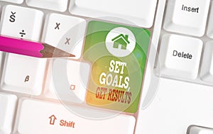 Text sign showing Set Goals Get Results. Conceptual photo Establish objectives work for accomplish them White pc