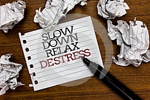 Text sign showing Slow Down Relax De Stress. Conceptual photo Have a break reduce stress levels rest calm Paper lumps laid randoml