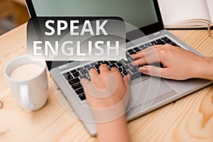 Text sign showing Speak English. Conceptual photo Study another Foreign Language Online Verbal Courses woman laptop