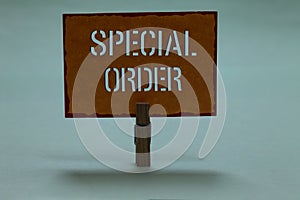 Text sign showing Special Order. Conceptual photo Specific Item Requested a Routine Memo by Military Headquarters Clothespin holdi photo