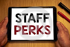 Text sign showing Staff Perks. Conceptual photos Workers Benefits Bonuses Compensation Rewards Health InsuranceMan hold holding ta
