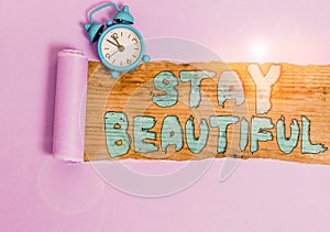 Text sign showing Stay Beautiful. Conceptual photo living authentically from your heart Being true to yourself Alarm clock and
