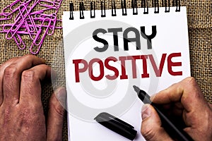 Text sign showing Stay Positive. Conceptual photo Be Optimistic Motivated Good Attitude Inspired Hopeful written by Man Holding Ma photo