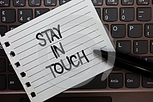 Text sign showing Stay In Touch. Conceptual photo Keep Connected thru Phone Letters Visit Email Social Media Notebook piece paper