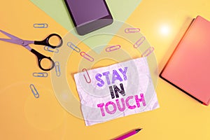 Text sign showing Stay In Touch. Conceptual photo Keep Connected thru Phone Letters Visit Email Social Media Paper