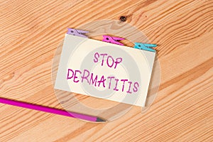 Text sign showing Stop Dermatitis. Conceptual photo Put an end in irritation caused by touching something Colored clothespin