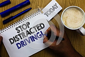 Text sign showing Stop Distracted Driving. Conceptual photo asking to be careful behind wheel drive slowly Man holding marker note