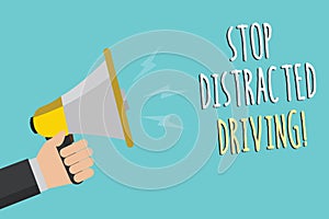 Text sign showing Stop Distracted Driving. Conceptual photo asking to be careful behind wheel drive slowly Man holding megaphone l