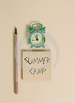 Text sign showing Summer Camp. Conceptual photo Supervised program for kids and teenagers during summertime. Metal