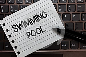 Text sign showing Swimming Pool. Conceptual photo Structure designed to hold water for leisure activities Notebook piece paper key