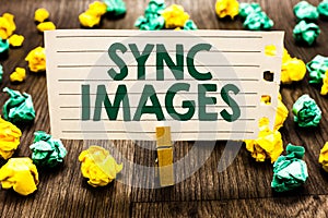 Text sign showing Sync Images. Conceptual photo Making photos identical in all devices Accessible anywhere Clothespin holding note